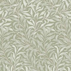 a green and white wallpaper with leaves on it