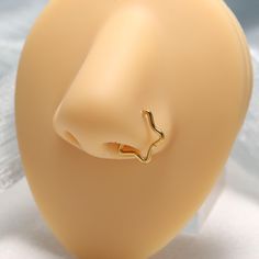 a close up of a plastic head with a ring on it