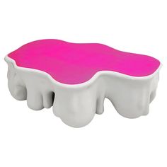 a pink and white object on a white background