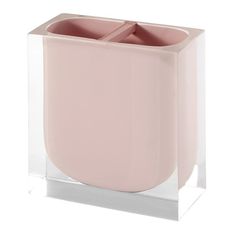 a pink vase sitting on top of a glass block