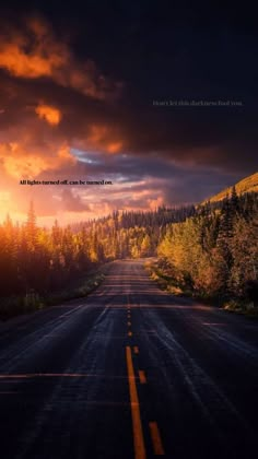 an empty road with the sun setting in the background and trees on both sides, under a cloudy sky