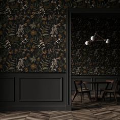 an empty room with black walls and floral wallpaper on the walls, along with two wooden chairs