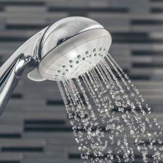 a shower head with water coming out of it