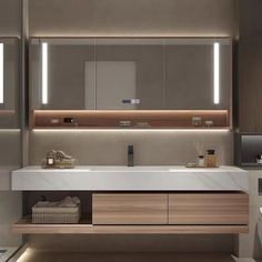 a modern bathroom with two sinks and large mirrors on the wall above it is illuminated by recessed lighting