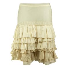 A Chloé pearl white skirt from the mid-2000s adorned in tiered ruffles from the hip down. The skirt is mid-thigh length fastened with a zip along the centre back. Elegant Tiered Ruffle Mini Skirt, Fitted Cream Bottoms With Ruffles, Fitted Beige Skirt With Ruffles, Fitted Tiered Ruffled Skirt, Elegant Fitted Tiered Bottoms, Fitted Tiered Skirt With Ruffle Hem, Beige Tiered Ruffle Bottoms, Fitted Tiered Mini Skirt With Ruffles, Cream Ruffled Skirted Bottoms