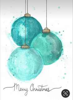 three blue christmas ornaments hanging from strings with the words merry christmas written on them in black ink