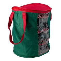 a large green bag with red handles and zippers on the side, filled with various items