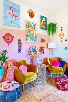 a living room filled with lots of colorful furniture and art on the wall above it