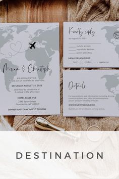 the wedding stationery is laid out on top of a wooden table with a map