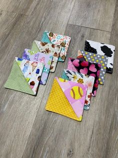 several pieces of fabric laid out on the floor next to each other with different designs