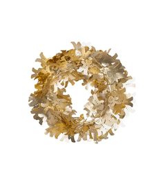 a gold and white wreath on a white background