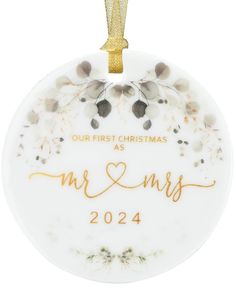 a personalized ornament for the first christmas as mr and mrs in gold lettering