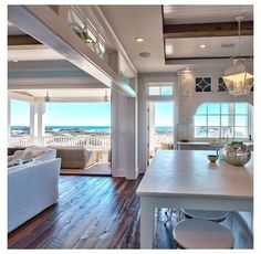 a kitchen and living room with an ocean view