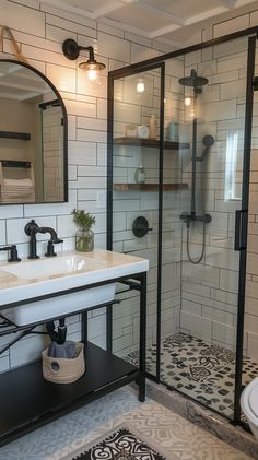 a bathroom with a walk in shower next to a sink