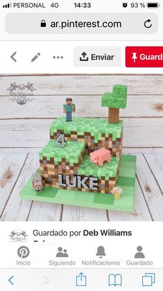 an image of a cake made to look like a minecraft village with the name luke on it