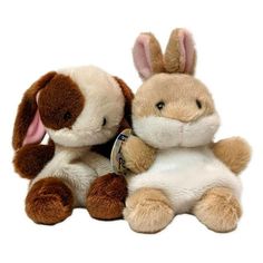 two stuffed animals sitting next to each other