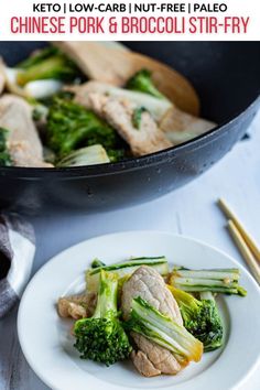 broccoli and chicken stir fry in a skillet with chopsticks on the side