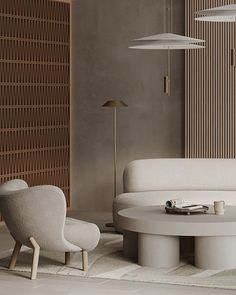 a living room with two chairs and a round table in front of a wooden paneled wall