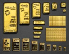 some gold bars and other metal items on a table