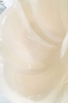 a close up view of some white frosting