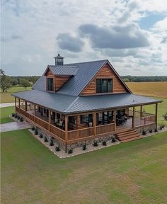 an aerial view of a large wooden house