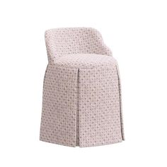 an upholstered chair with a flower pattern on the seat and back, in light purple