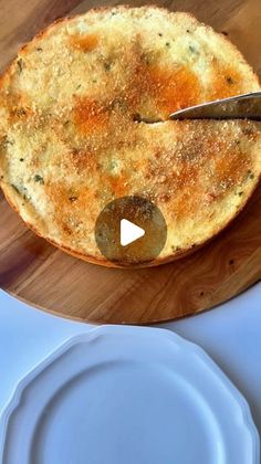 a wooden cutting board topped with a cheese pizza