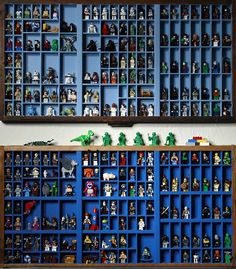 two wooden shelves filled with legos on top of blue shelving unit units, each containing different types of action figures