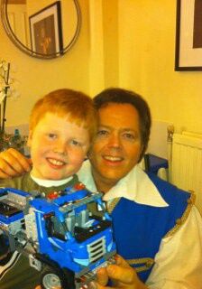 a man and boy are holding a toy truck