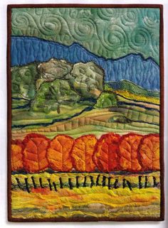 a quilted wall hanging with trees and mountains in the background