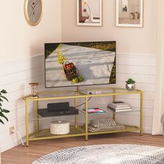 a flat screen tv sitting on top of a metal stand