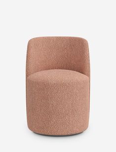 an upholstered pink chair on a white background