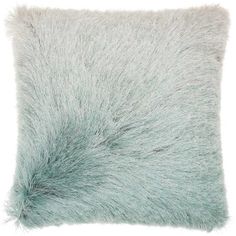 a light blue pillow with fluffy fur on it