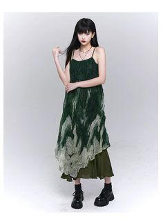 The LadyGhost Forest Sprite Layered Maxi Dress is a women's green ombre tie-dye slip dress featuring a layered design and an asymmetrical hem. This ethereal dress combines a forest-inspired color palette with a flowing, bohemian silhouette, perfect for special occasions or a dreamy summer look. Model's measurements: Height 167cm, Weight 48kg, wearing size M. Forest Sprite, Green Suspenders, Layered Maxi Dress, Painted Leather Jacket, Green Slip Dress, Ethereal Dress, Green Gradient, Green Ombre, Suspender Dress