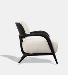 a white chair with black legs and arms