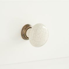 a white door knob with a crackled design on it's front and side