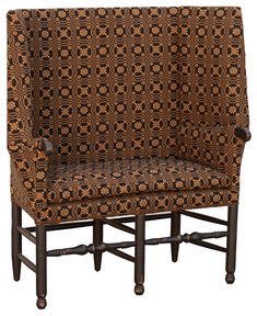 a brown and black patterned upholstered chair