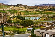 an aerial view of a small town with mountains in the background