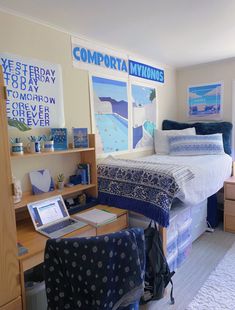 a bed room with a neatly made bed next to a computer desk and shelves on the wall