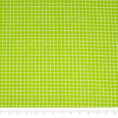 a ruler is next to a green and white checkered fabric