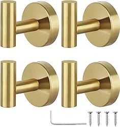 four brass door knobs and screws on a white background