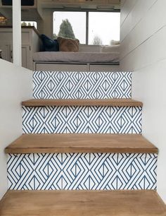 some stairs with blue and white tiles on them