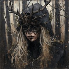 a woman with long blonde hair wearing a black mask and deer antlers on her head