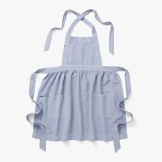 a blue apron with straps hanging from it's chest and the back of its neck