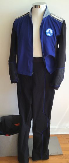 a mannequin is dressed in blue and black