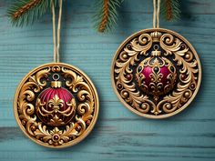 two ornaments hanging from a christmas tree on a blue wooden background with pine branches in the foreground