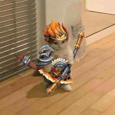 a white cat with an orange and blue flame on it's head holding two swords