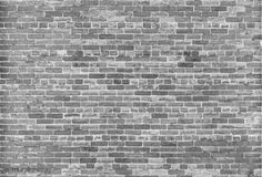 a black and white photo of a brick wall that has been made into a background