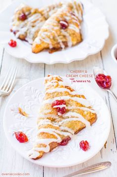 cranberry and cream cheese turnovers on white plates