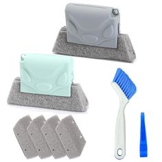 the toothbrush is next to three cleaning pads and a blue brush on a white background